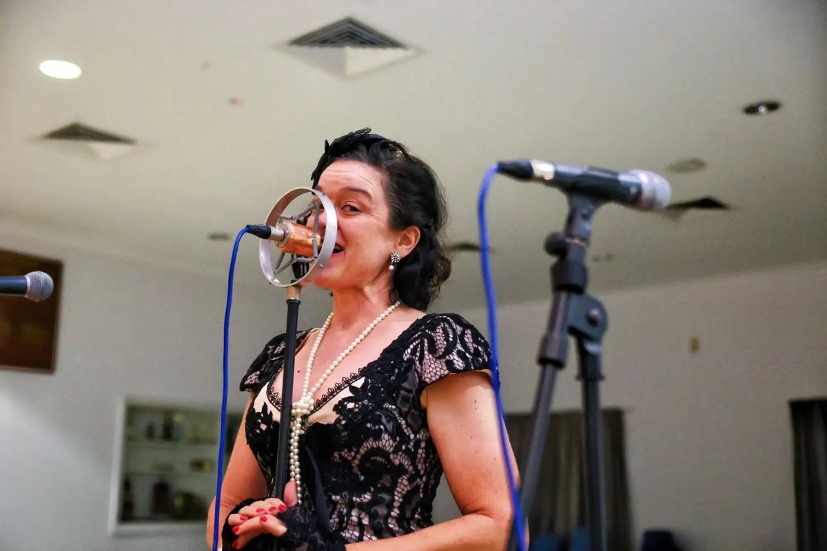 A singer performing at the Lions 60th anniversary dinner